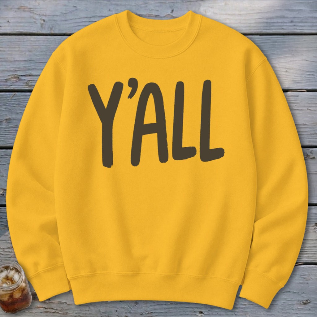 Yellow crewneck sweatshirt with dark brown text reading "Y'ALL".