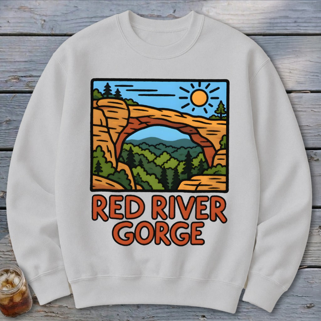 White sweatshirt with "Red River Gorge" text and a cartoon landscape.