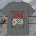 Gray v-neck t-shirt with a distressed sign graphic reading "CRICK" crossed out and "CREEK" checked.