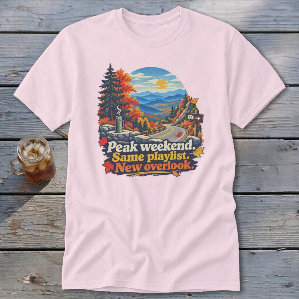 T-shirt with fall mountain scene and text: Peak weekend, Same playlist, New overlook.