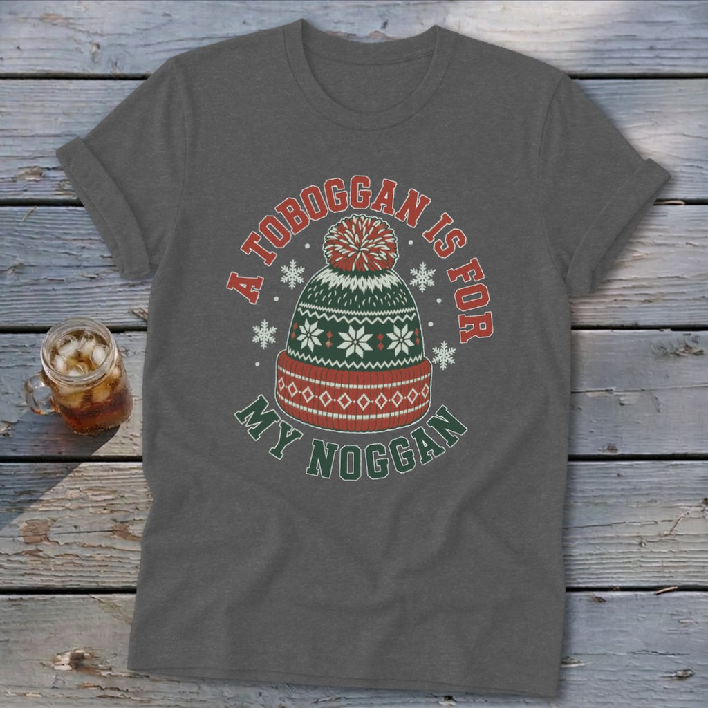 Dark gray short-sleeve t-shirt with a graphic of a winter hat and the text A TOBOGGAN IS FOR MY NOGGAN.