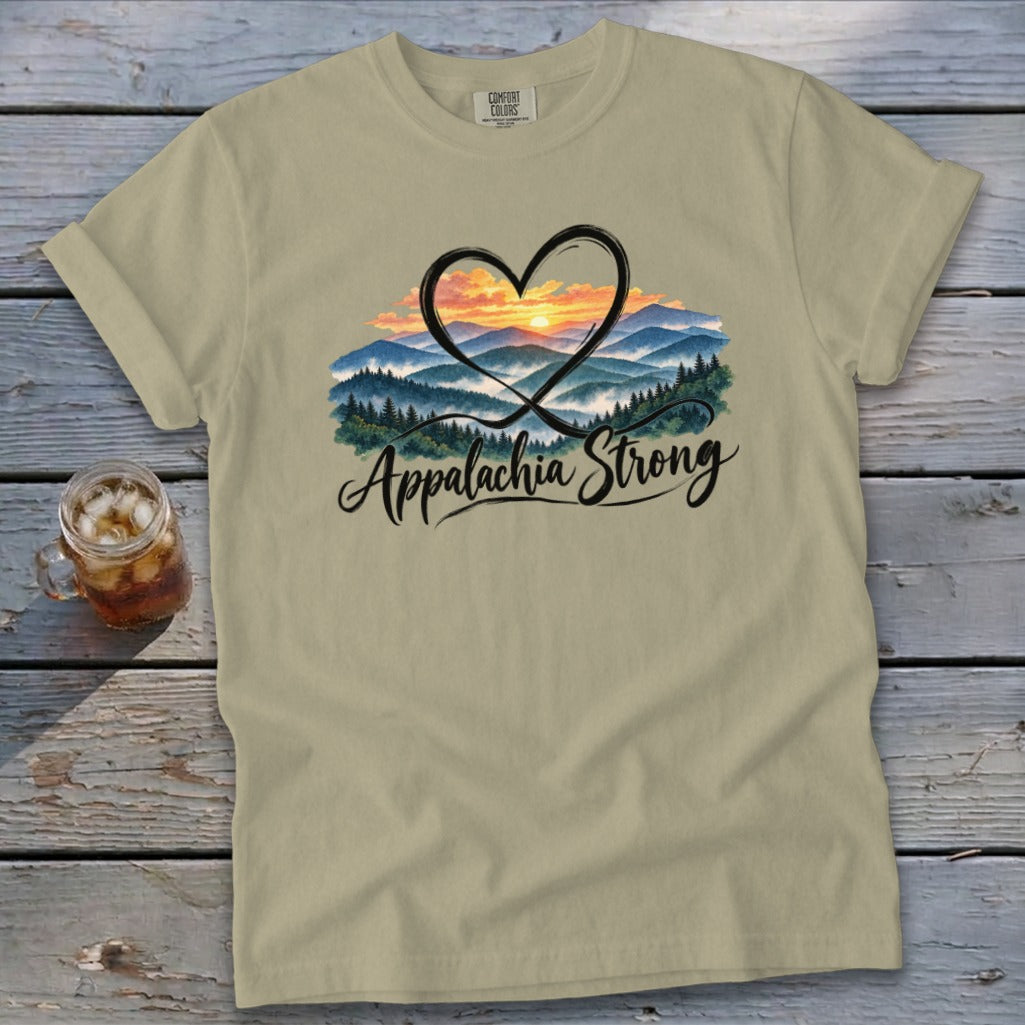 Tan t-shirt with "Appalachia Strong" text and heart-shaped mountain sunset graphic.