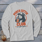 White long-sleeve shirt with "Porch Sittin' Club est. after supper" graphic and a bear drinking from a jar.