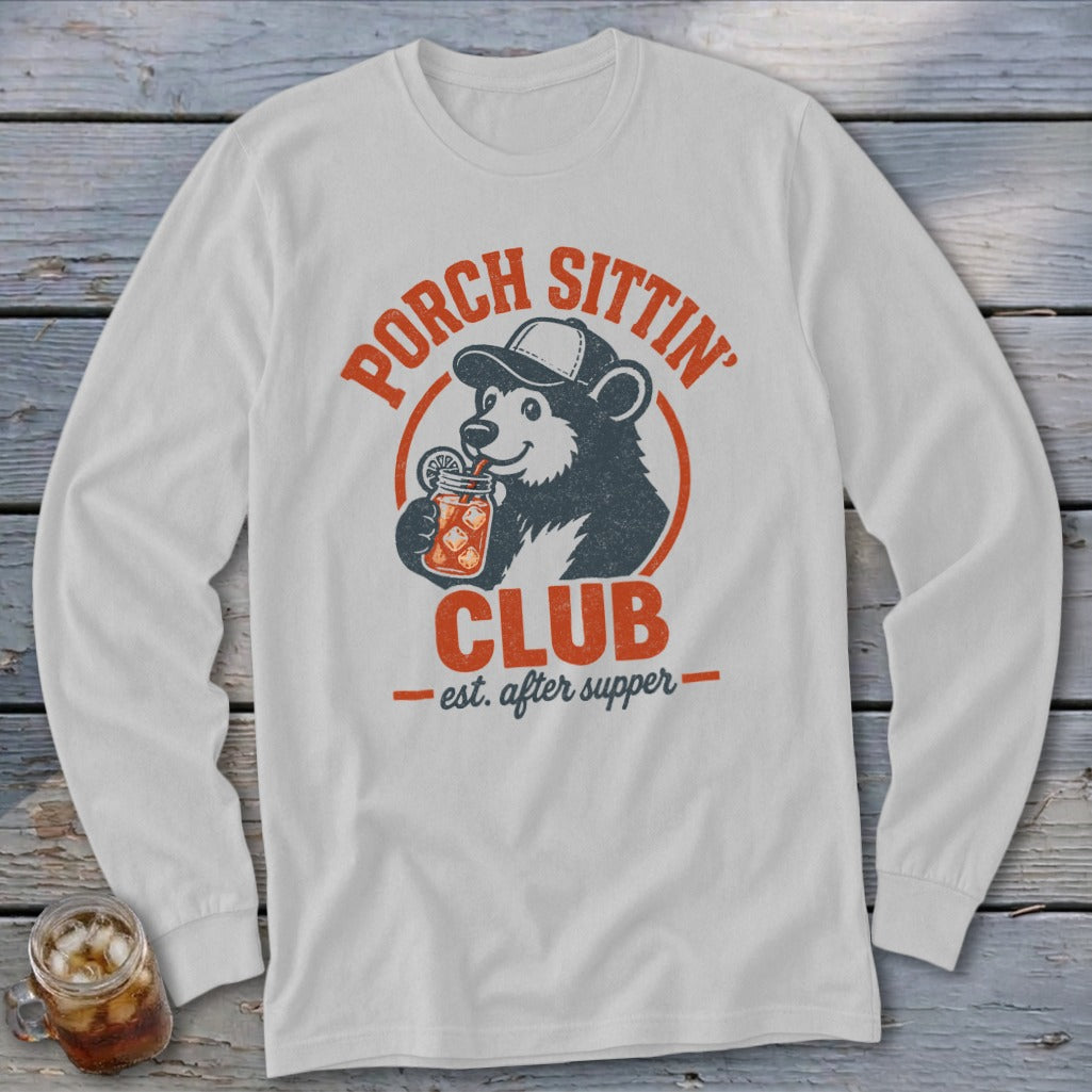 White long-sleeve shirt with "Porch Sittin' Club est. after supper" graphic and a bear drinking from a jar.