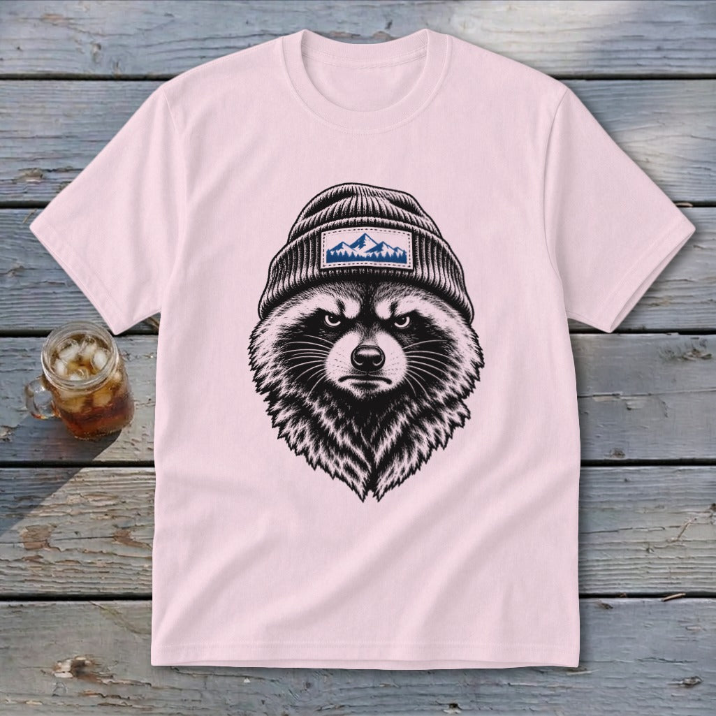 Pink t-shirt with black raccoon wearing beanie with mountain patch.