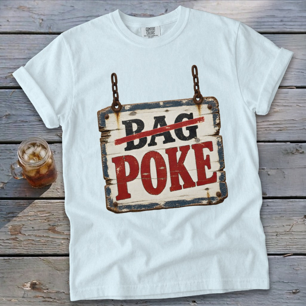 A light blue t-shirt printed with a rustic wooden sign that reads BAG POKE.