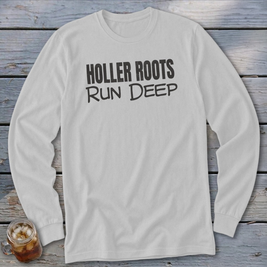 White long-sleeve t-shirt with black text "HOLLER ROOTS RUN DEEP"