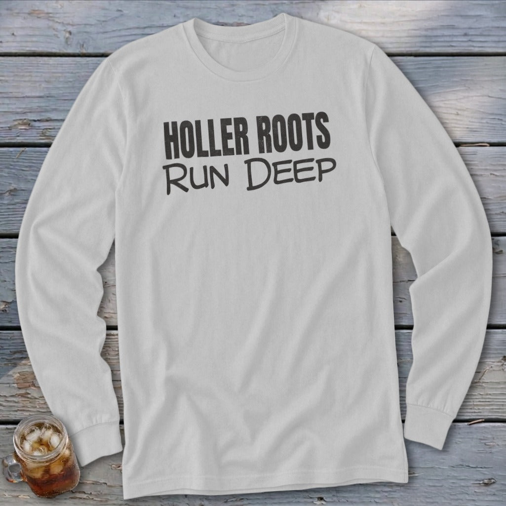 White long-sleeve t-shirt with black text "HOLLER ROOTS RUN DEEP"