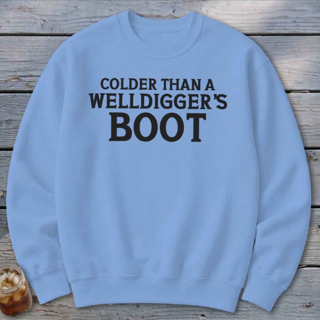 Light blue crewneck sweatshirt with black text "Colder than a Welldigger's Boot".