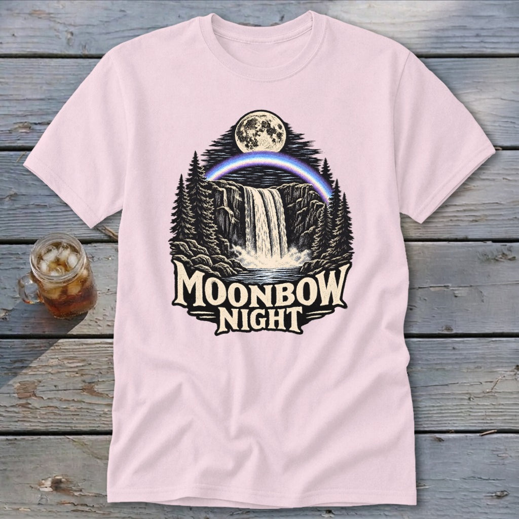 Pink t-shirt graphic with waterfall, moonbow, moon, trees, and text "Moonbow Night".