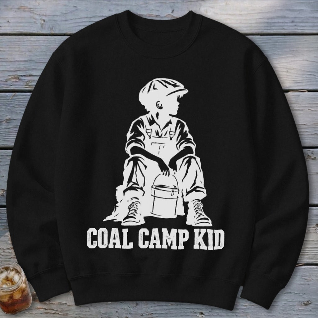 Black sweatshirt with white graphic of a boy in overalls and cap holding a bucket, text reads "COAL CAMP KID".