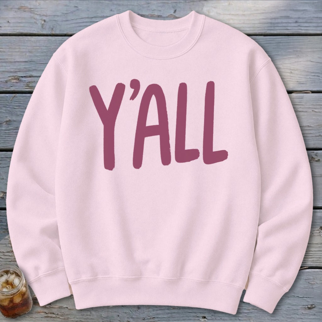 Pink crewneck sweatshirt with "Y'ALL" printed in burgundy.