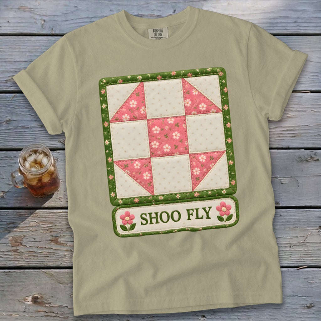 Light tan t-shirt with a Shoo Fly quilt block design and text.