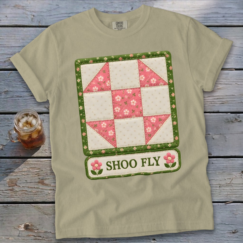 Light tan t-shirt with a Shoo Fly quilt block design and text.