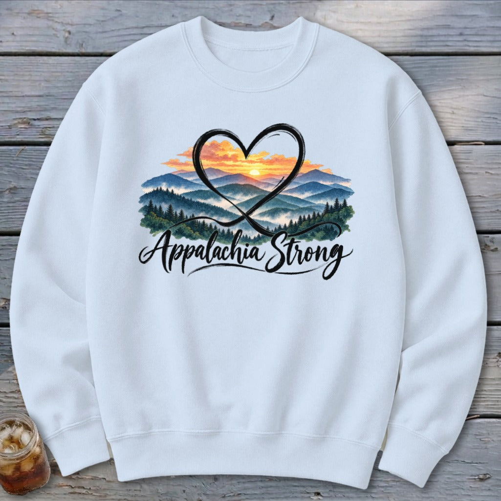 White sweatshirt with a graphic of mountains, sunset, and "Appalachia Strong" text.