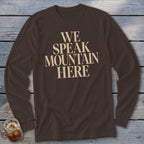 Brown long sleeve shirt with "WE SPEAK MOUNTAIN HERE" text in beige.