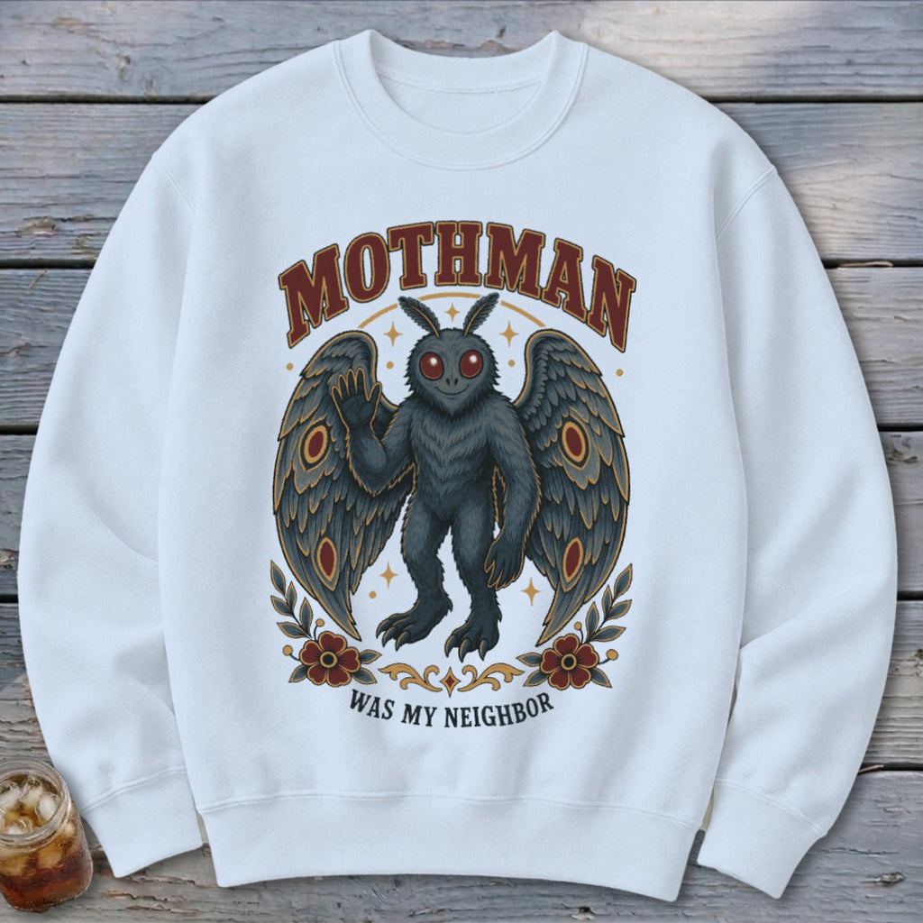 White sweatshirt with a Mothman graphic and text "MOTHMAN WAS MY NEIGHBOR".