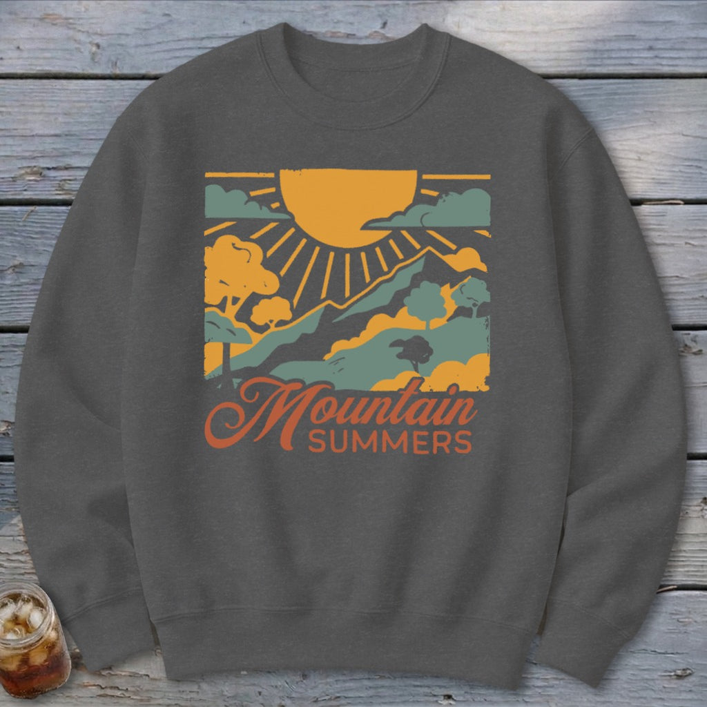 Dark grey sweatshirt with "Mountain Summers" text and a mountain landscape graphic.