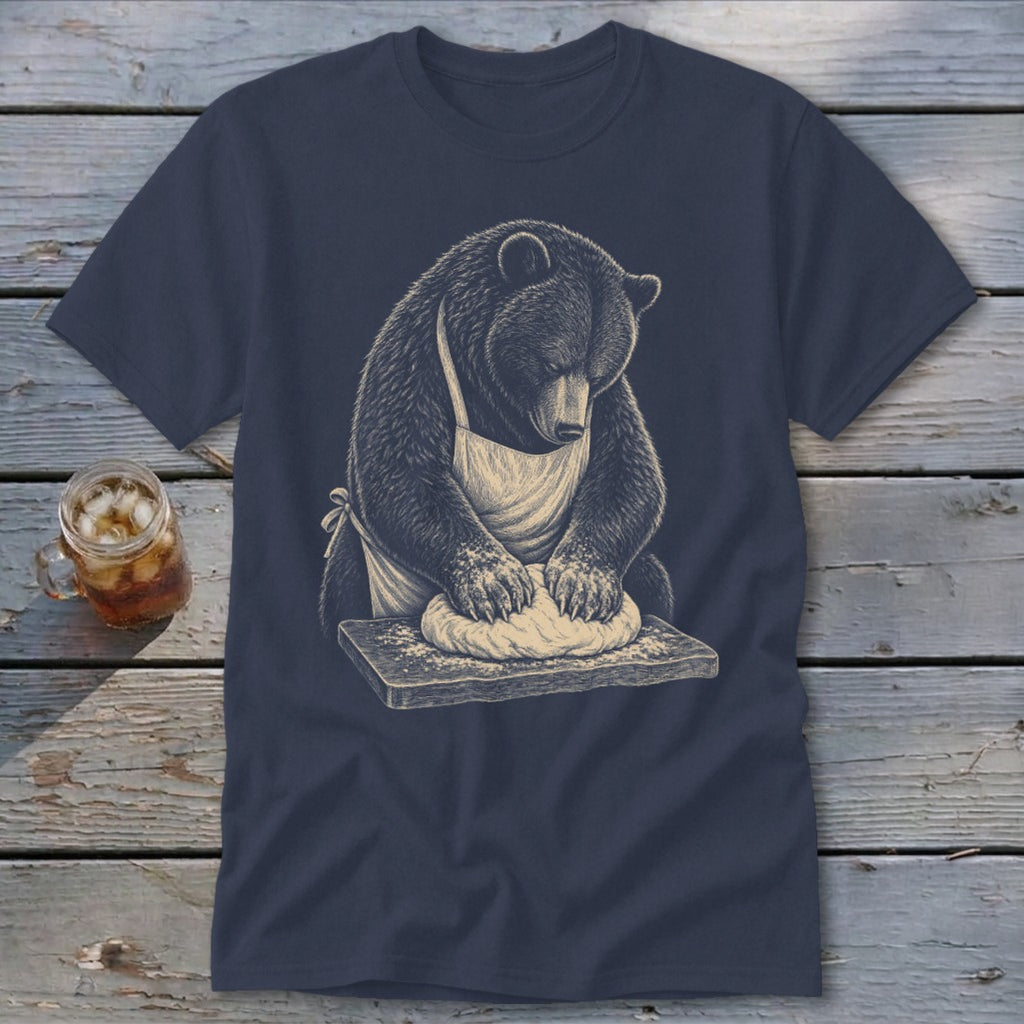 Bear wearing an apron kneads dough on a wooden board.