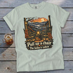 Light blue t-shirt with autumn scene and text "Pull up a chair The holler's talkin'".