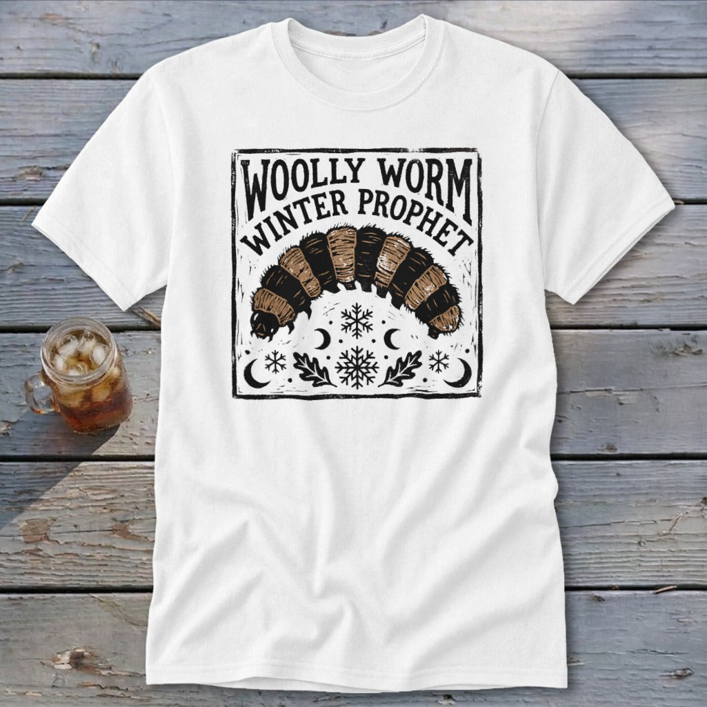 A white t-shirt featuring a black and brown graphic of a woolly worm with the text Woolly Worm Winter Prophet.