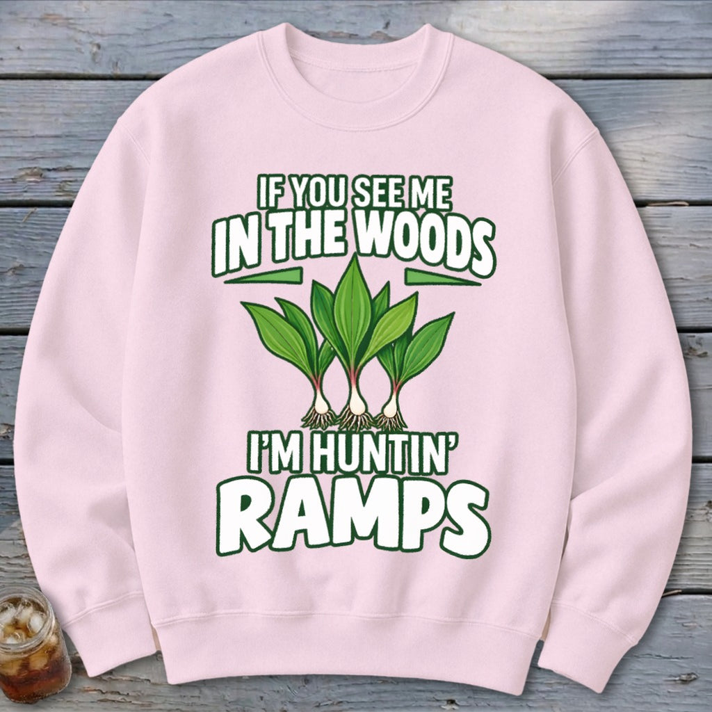 Light pink crewneck sweatshirt featuring green text that reads IF YOU SEE ME IN THE WOODS I'M HUNTIN RAMPS above a graphic of three ramp plants.