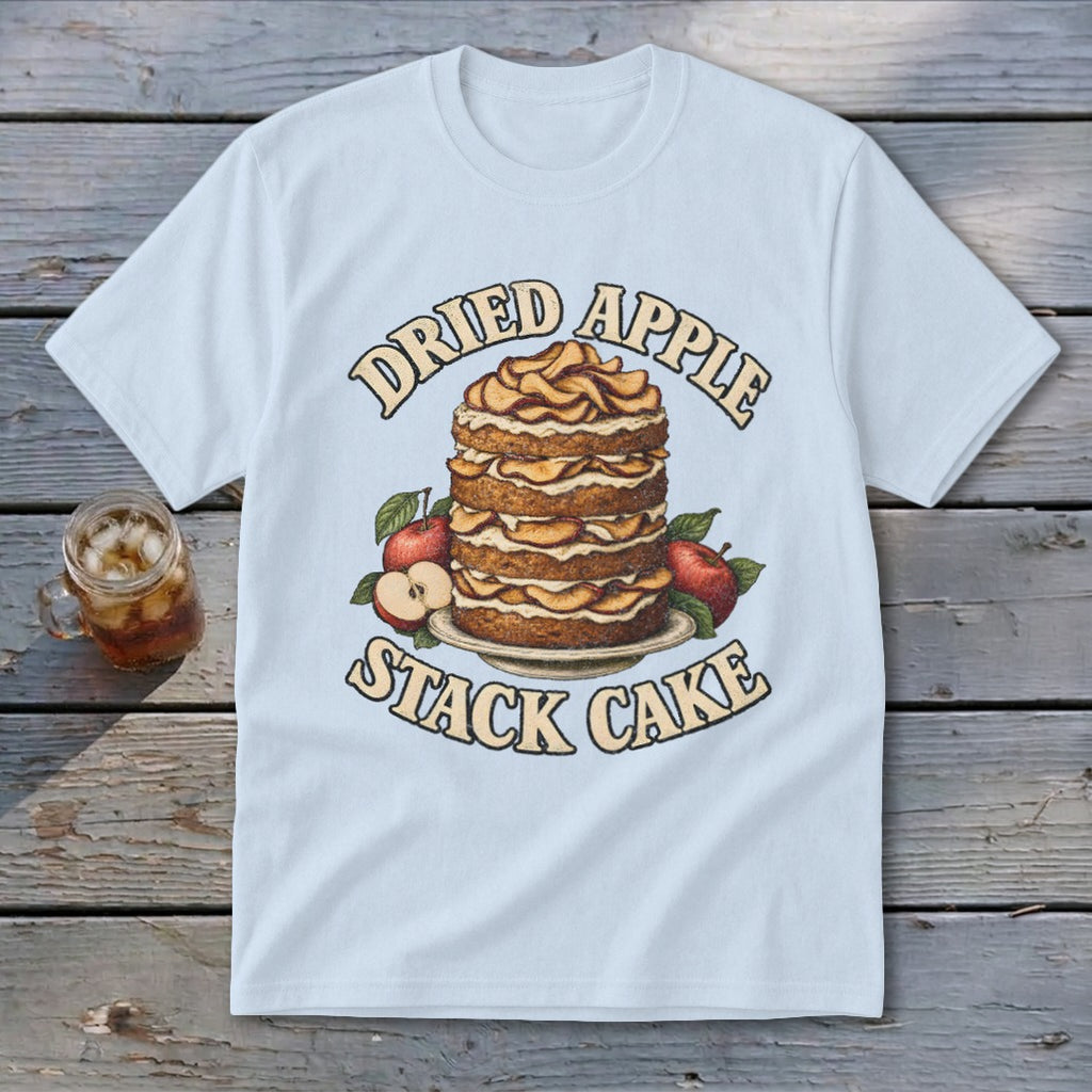 Light blue t-shirt with "Dried Apple Stack Cake" text and illustration of a cake with apples.