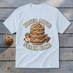 Light blue t-shirt with "Dried Apple Stack Cake" text and illustration of a cake with apples.