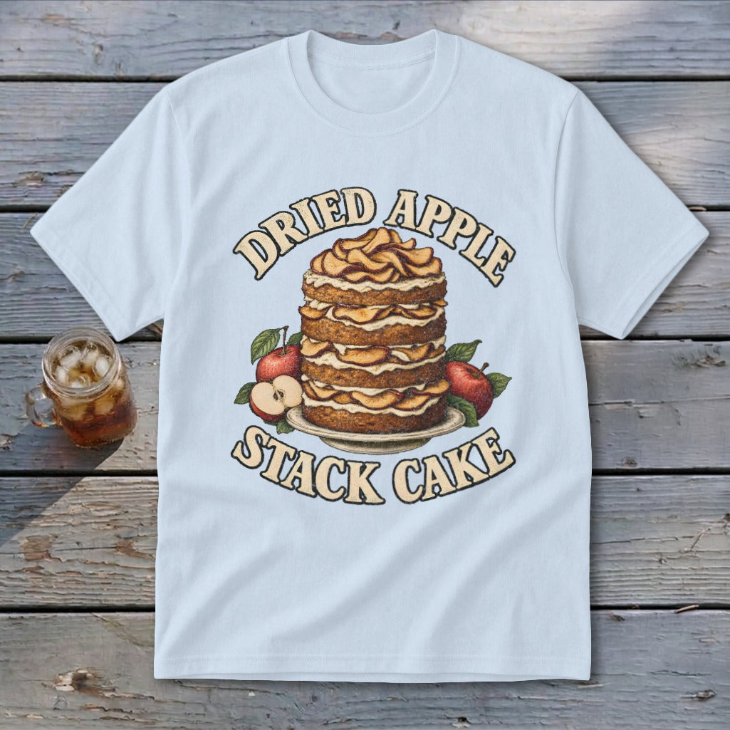 Light blue t-shirt with "Dried Apple Stack Cake" text and illustration of a cake with apples.