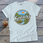 White t-shirt with "Kentucky" text and a scenic landscape design.