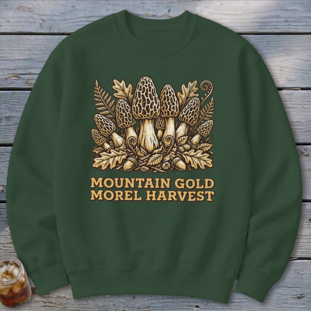 Green sweatshirt with illustration of morel mushrooms, leaves, acorns, and text "MOUNTAIN GOLD MOREL HARVEST".