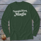 Dark green long-sleeve shirt with white text reading "Appalachian Magic".
