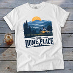 White t-shirt with "The Home Place" text and a landscape graphic.