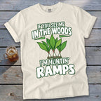 Cream-colored t-shirt featuring green text reading IF YOU SEE ME IN THE WOODS I'M HUNTIN' RAMPS and an illustration of three ramps.