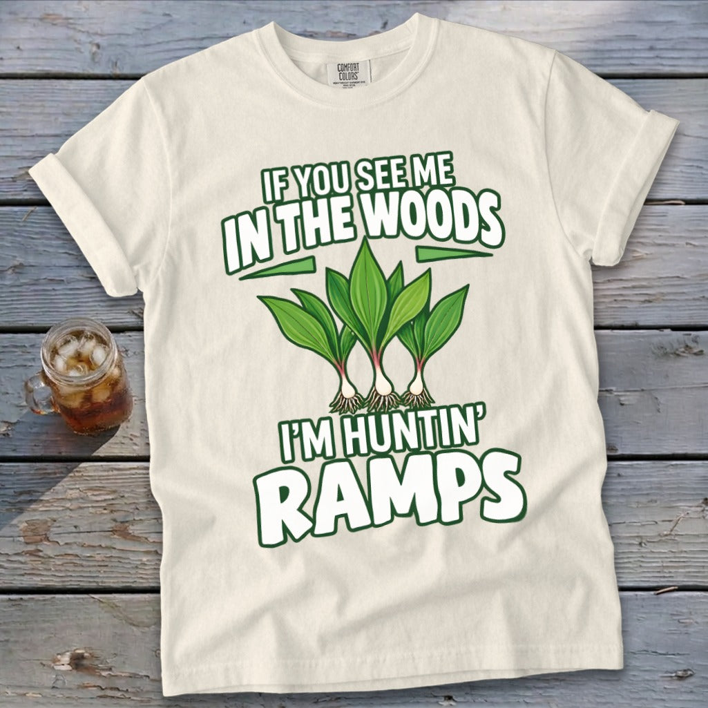 Cream-colored t-shirt featuring green text reading IF YOU SEE ME IN THE WOODS I'M HUNTIN' RAMPS and an illustration of three ramps.