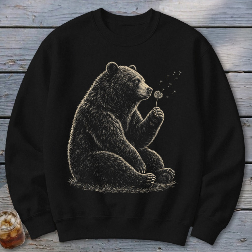 Black sweatshirt featuring a detailed illustration of a bear blowing on a dandelion.