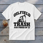 White t-shirt with black text and oil rig graphic: OILFIELD TRASH AND PROUD OF IT.