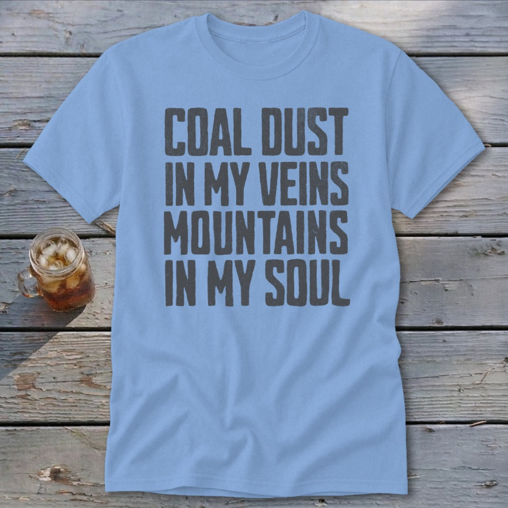 Light blue crewneck t-shirt featuring the dark grey distressed text COAL DUST IN MY VEINS MOUNTAINS IN MY SOUL.