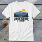 White t-shirt with "Ridge Runner Morning" text and mountain landscape graphic.