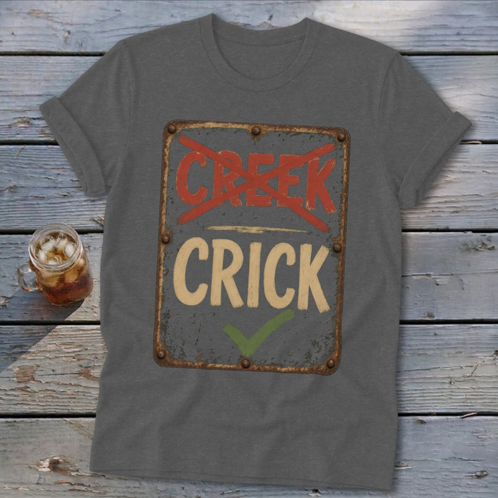 Gray t-shirt with a distressed sign reading "CREEK" crossed out and "CRICK" with a checkmark.