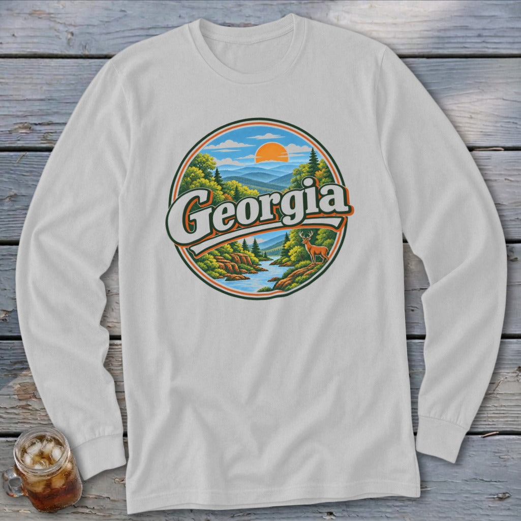 White long-sleeve shirt with a circular Georgia landscape graphic featuring mountains, river, deer, and sun.