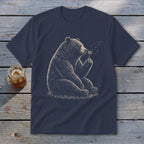 Navy t-shirt with a detailed illustration of a bear sitting and holding a dandelion.
