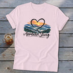 Pink t-shirt with "Appalachia Strong" text and a heart framing a mountain sunset.