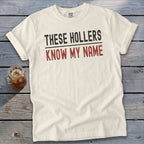 Cream t-shirt with text "THESE HOLLERS KNOW MY NAME".