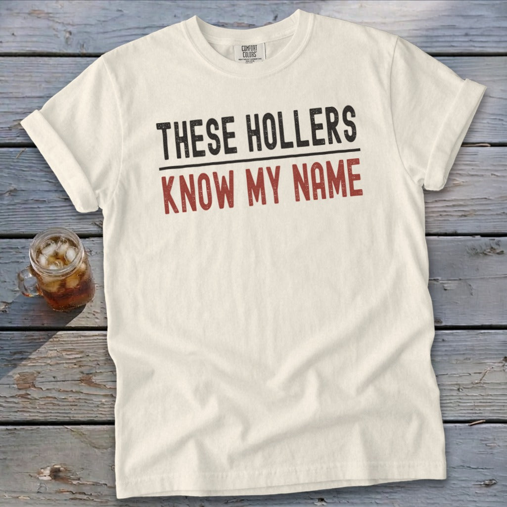 Cream t-shirt with text "THESE HOLLERS KNOW MY NAME".