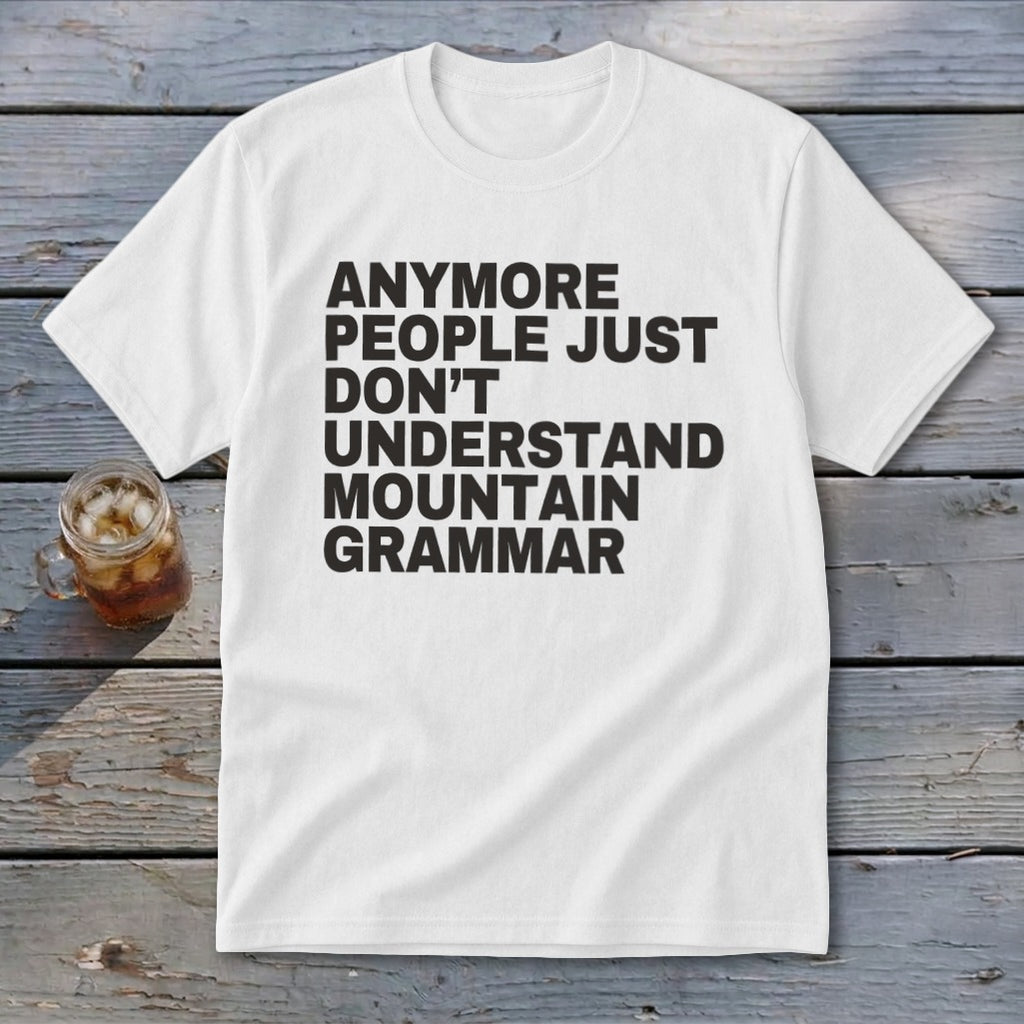White t-shirt with black text "Anymore people just don't understand mountain grammar."