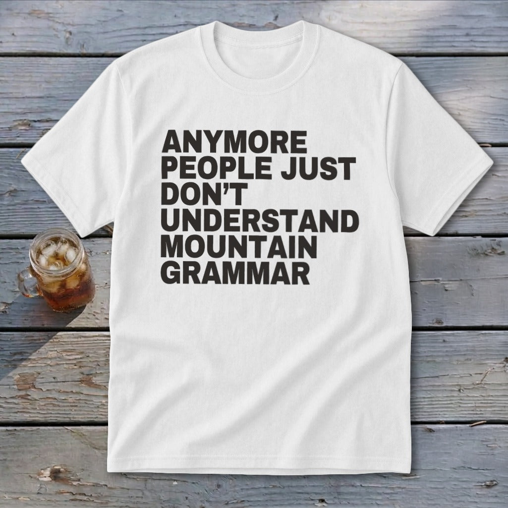 White t-shirt with black text "Anymore people just don't understand mountain grammar."