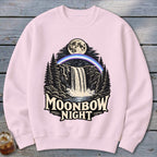 Pink sweatshirt with "Moonbow Night" graphic of waterfall, moon, and rainbow.