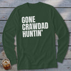 Dark green long sleeve shirt with white text "GONE CRAWDAD HUNTIN'".