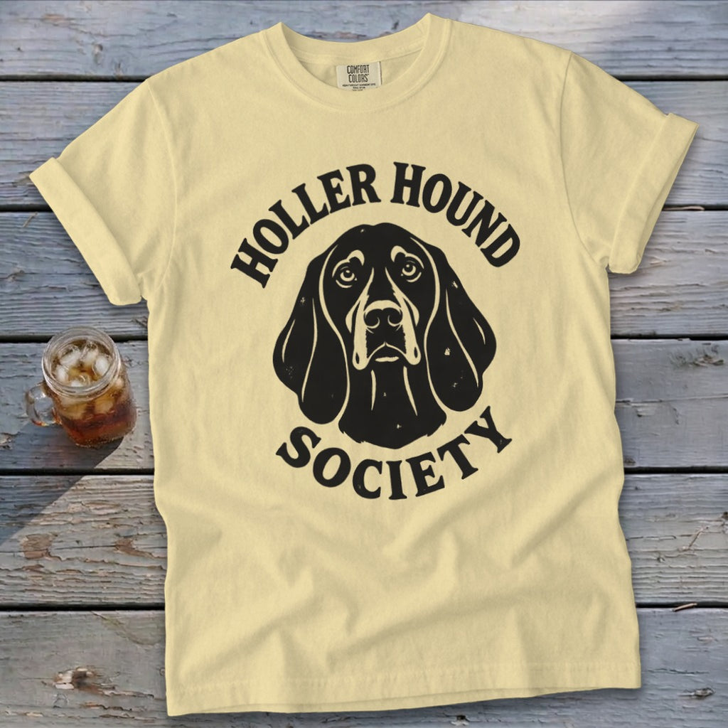 Yellow t-shirt with black "Holler Hound Society" text and dog graphic.